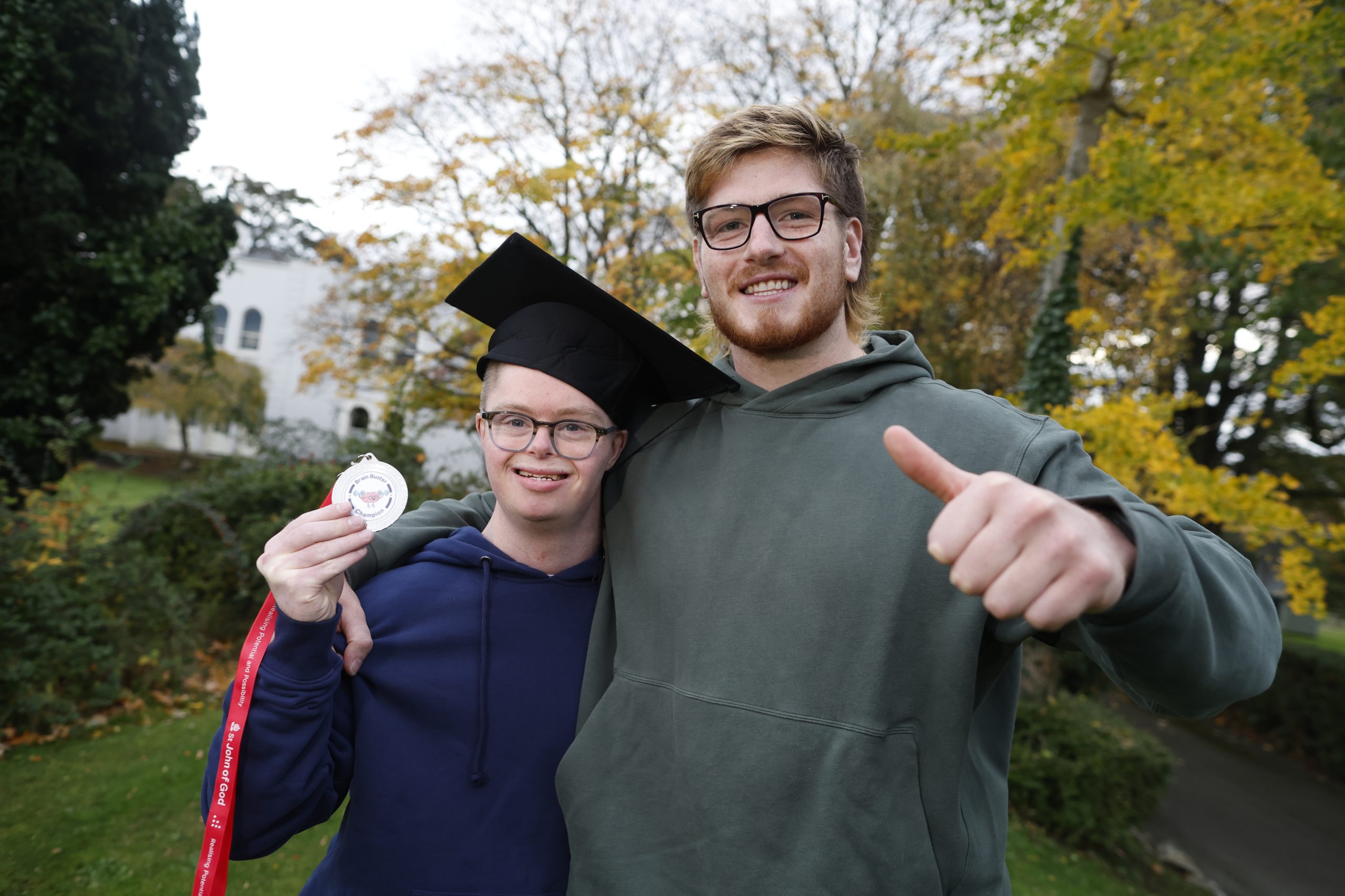 Andrew and Joe medal and thumbs up